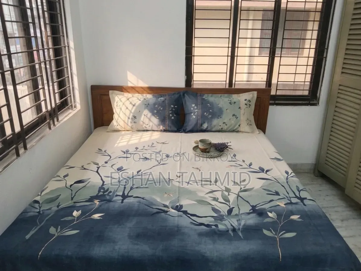 Teak wood bed.