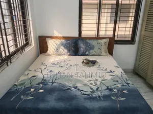 Teak wood bed.