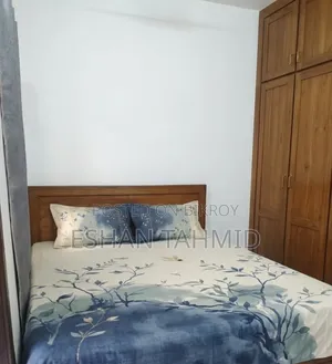 Teak wood bed.