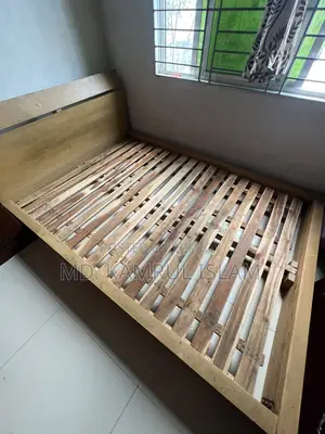Mahogany Wooden Floor Bed for Sale Along With Its Mattress.