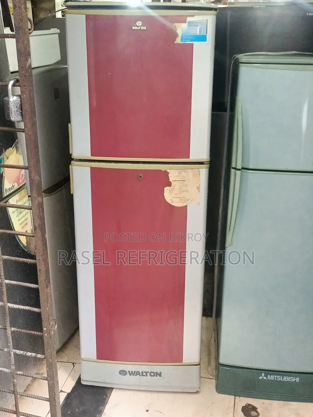 Red 14 Cubic Feet Walton Refrigerator for sale.