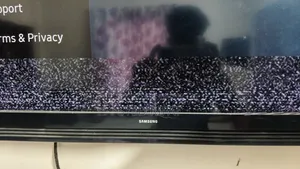 This Is A Samsung Smart Tv Featuring A Black Bezel Wall-mounted Setup