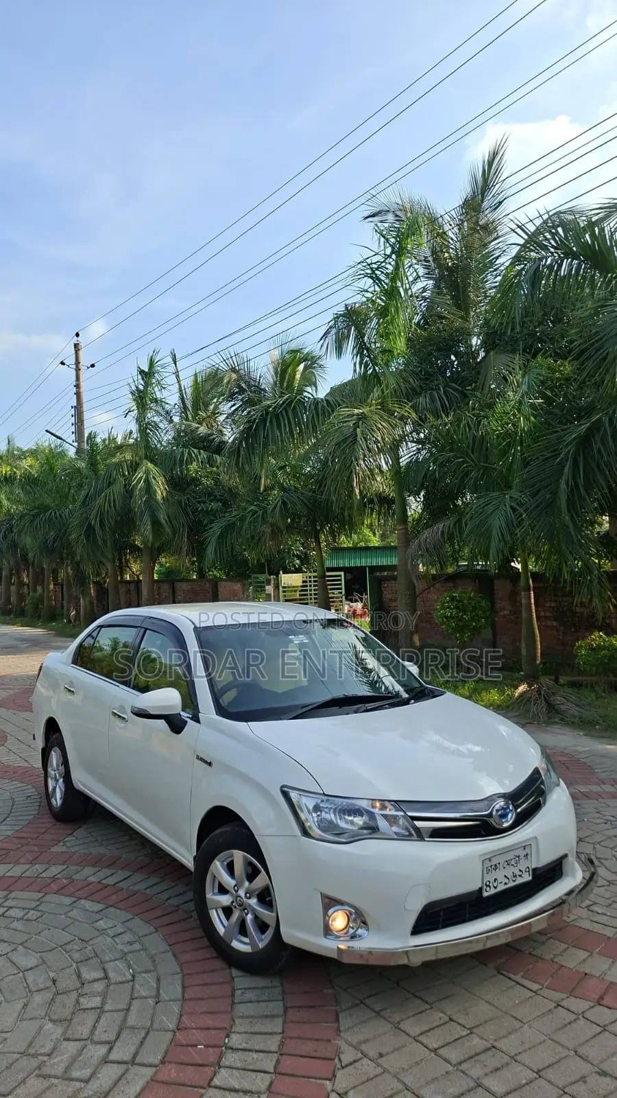 টয়োটা এক্সিও ১.৫ হাইব্রিড ২ডব্লিউডি ২০১৪ সাদা