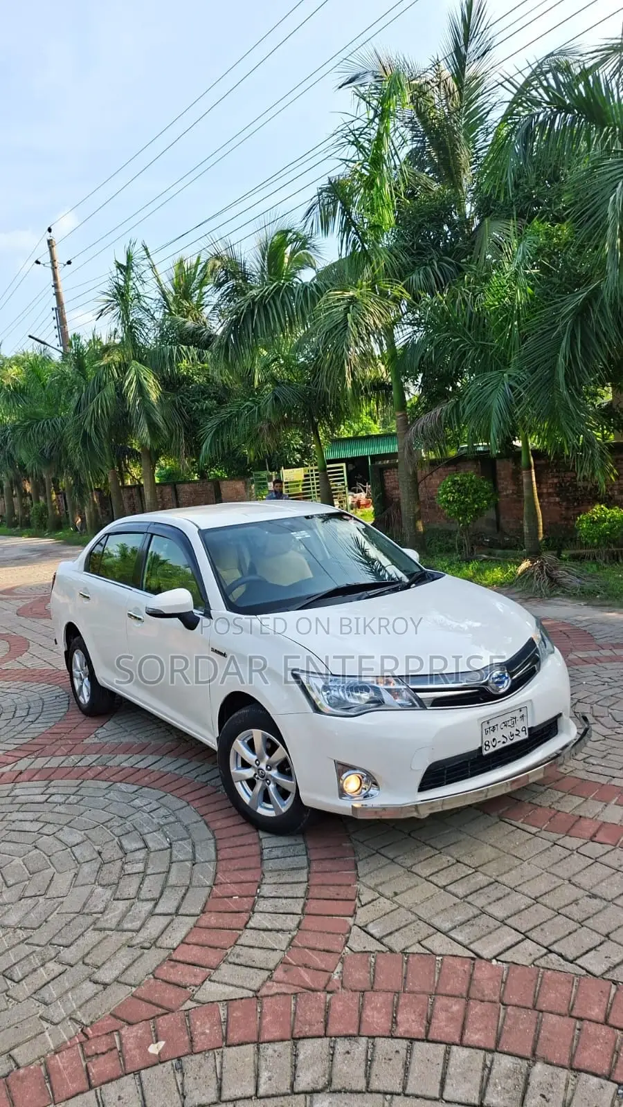 টয়োটা এক্সিও ১.৫ হাইব্রিড ২ডব্লিউডি ২০১৪ সাদা