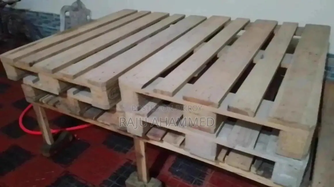4 wooden pallets and 1 wooden bed frame for sale.