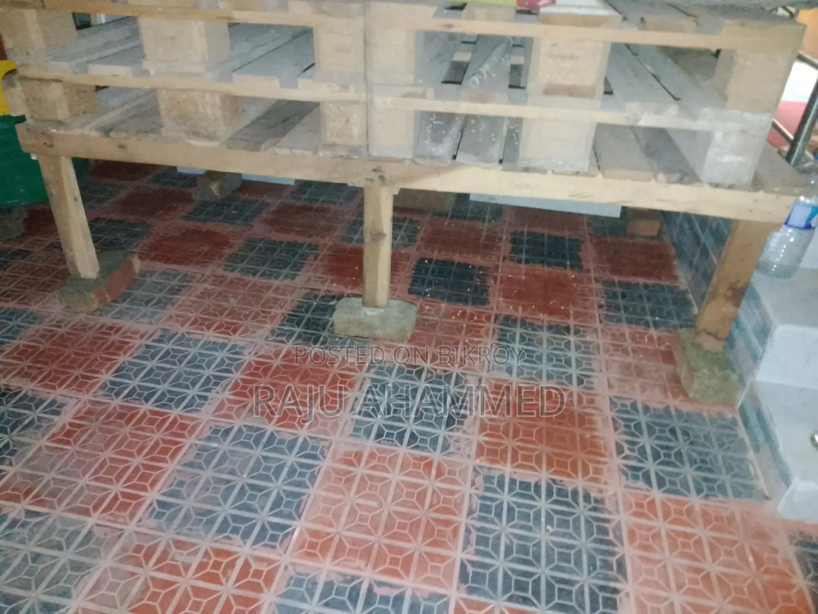 4 wooden pallets and 1 wooden bed frame for sale.