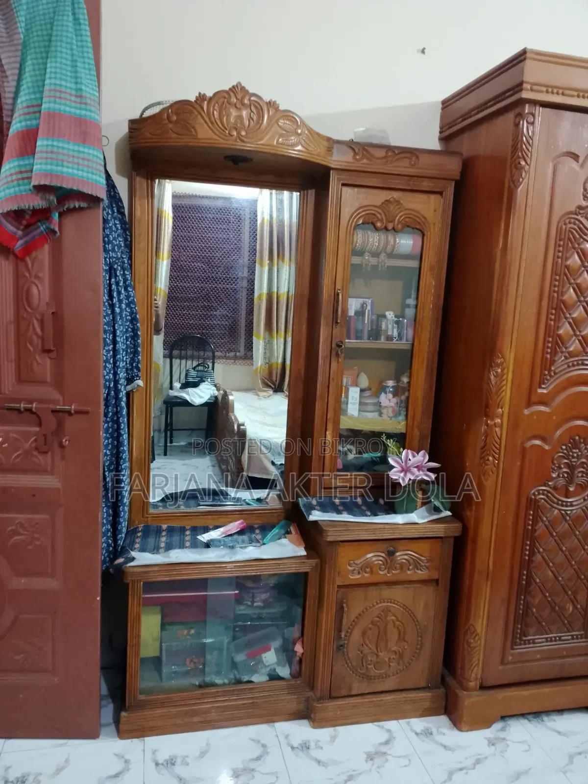 A teak wood dressing table will be sold
