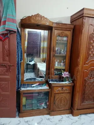 A teak wood dressing table will be sold