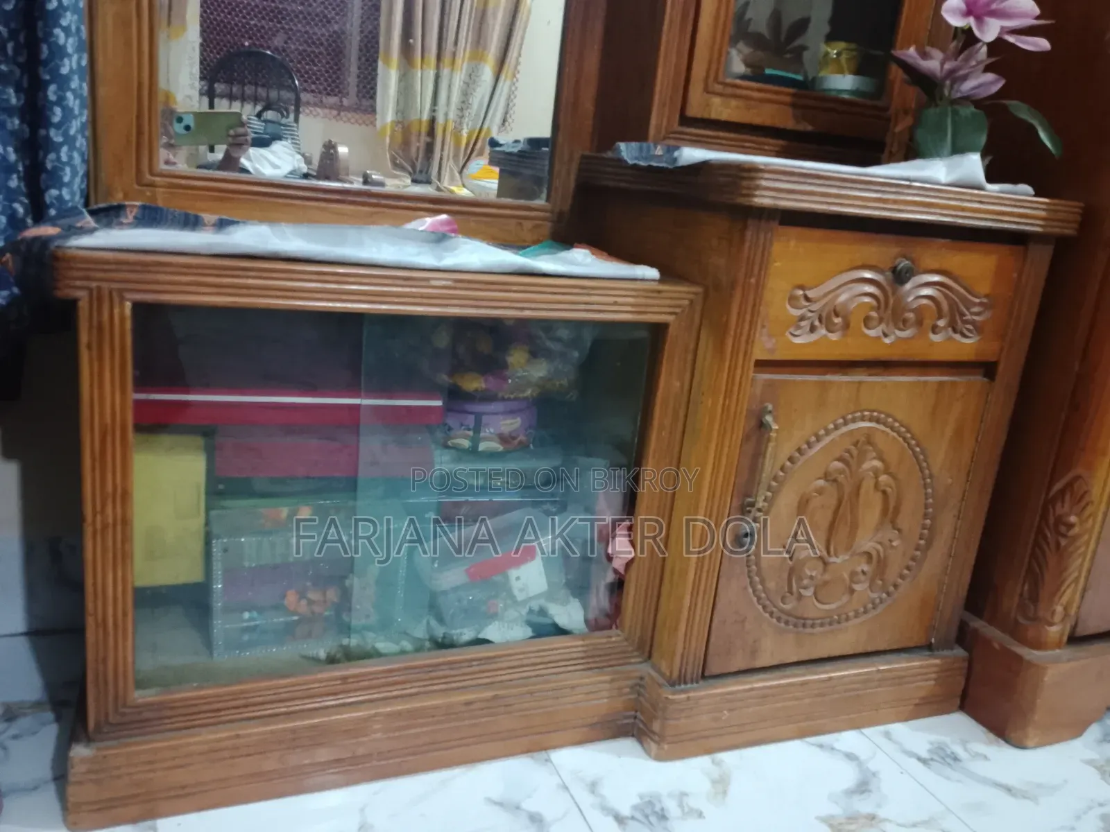A teak wood dressing table will be sold