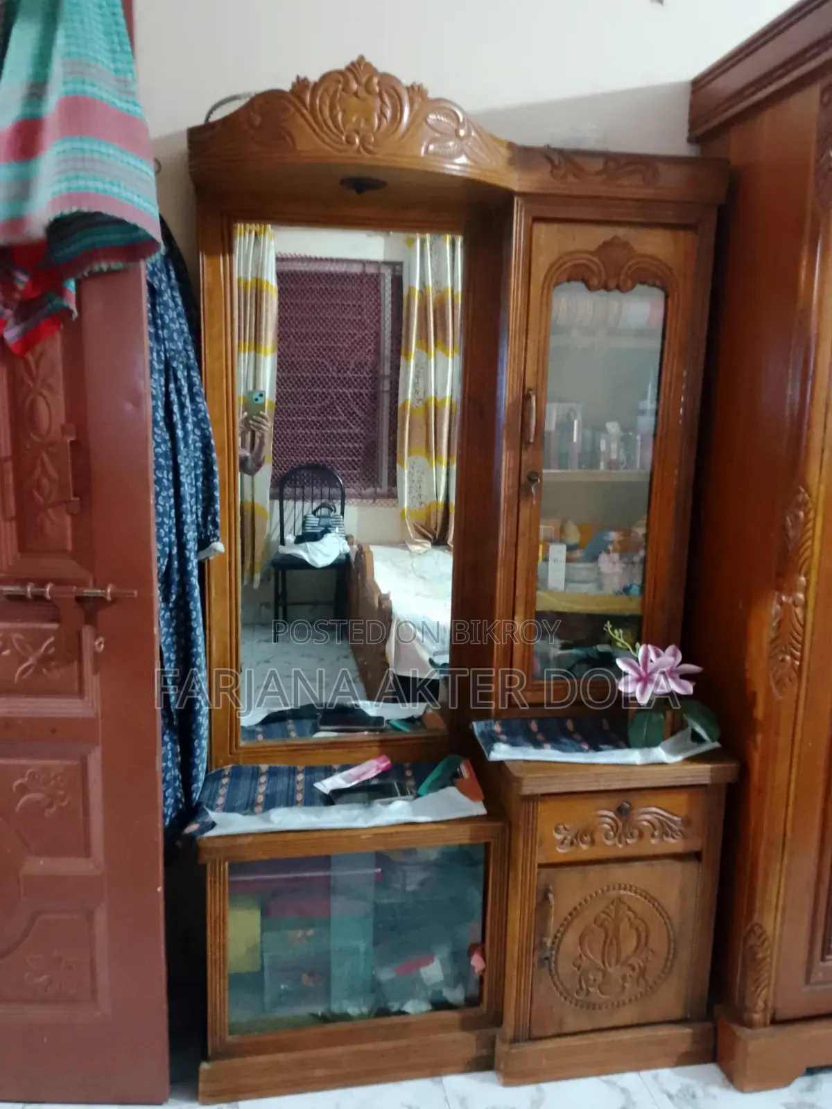 A teak wood dressing table will be sold