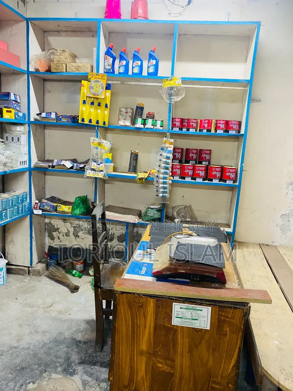 Shop wooden shelves and shop goods for sale.