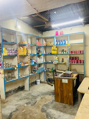 Shop wooden shelves and shop goods for sale.