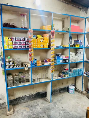 Shop wooden shelves and shop goods for sale.