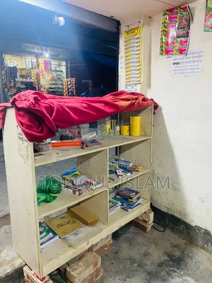 Shop wooden shelves and shop goods for sale.