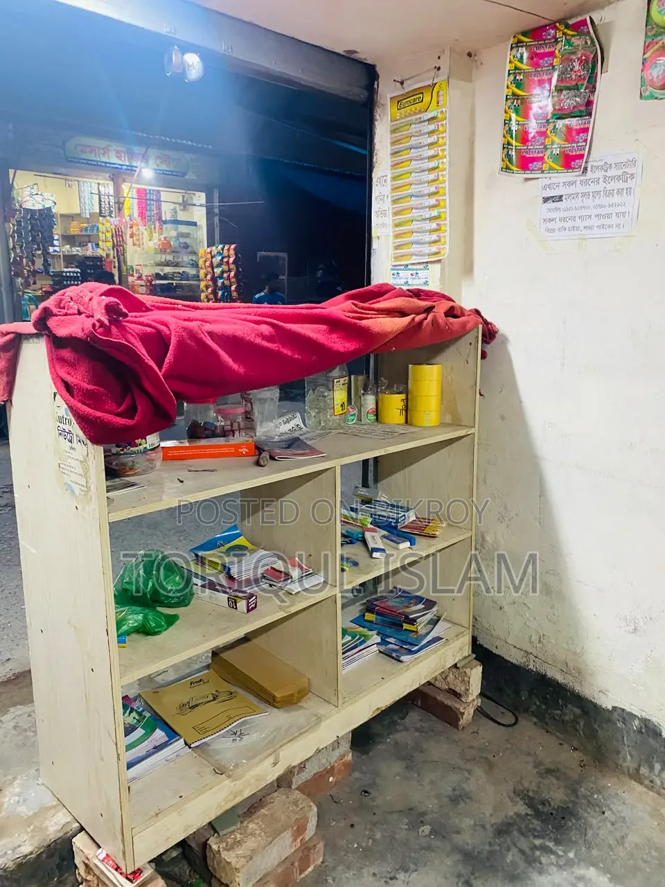Shop wooden shelves and shop goods for sale.