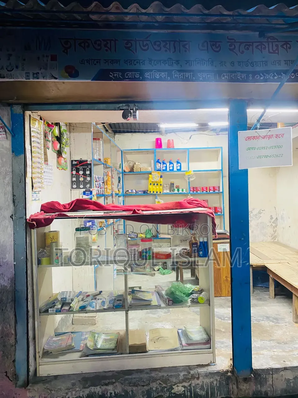 Shop wooden shelves and shop goods for sale.