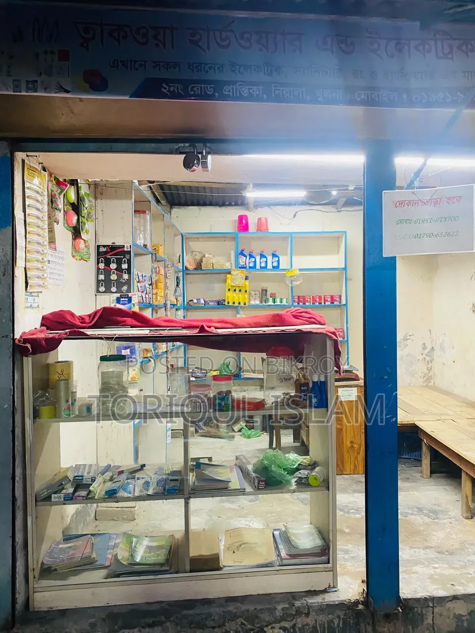 Shop wooden shelves and shop goods for sale.