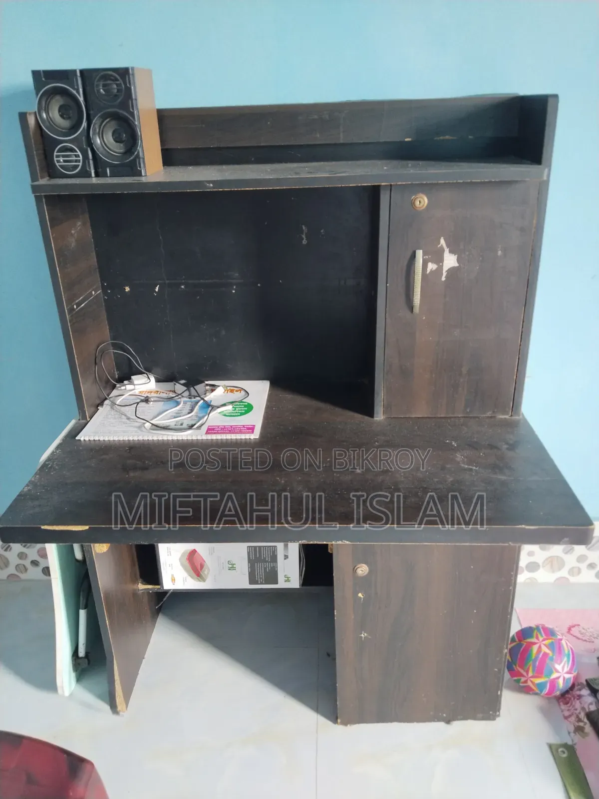 A double bed frame and a computer table for sale