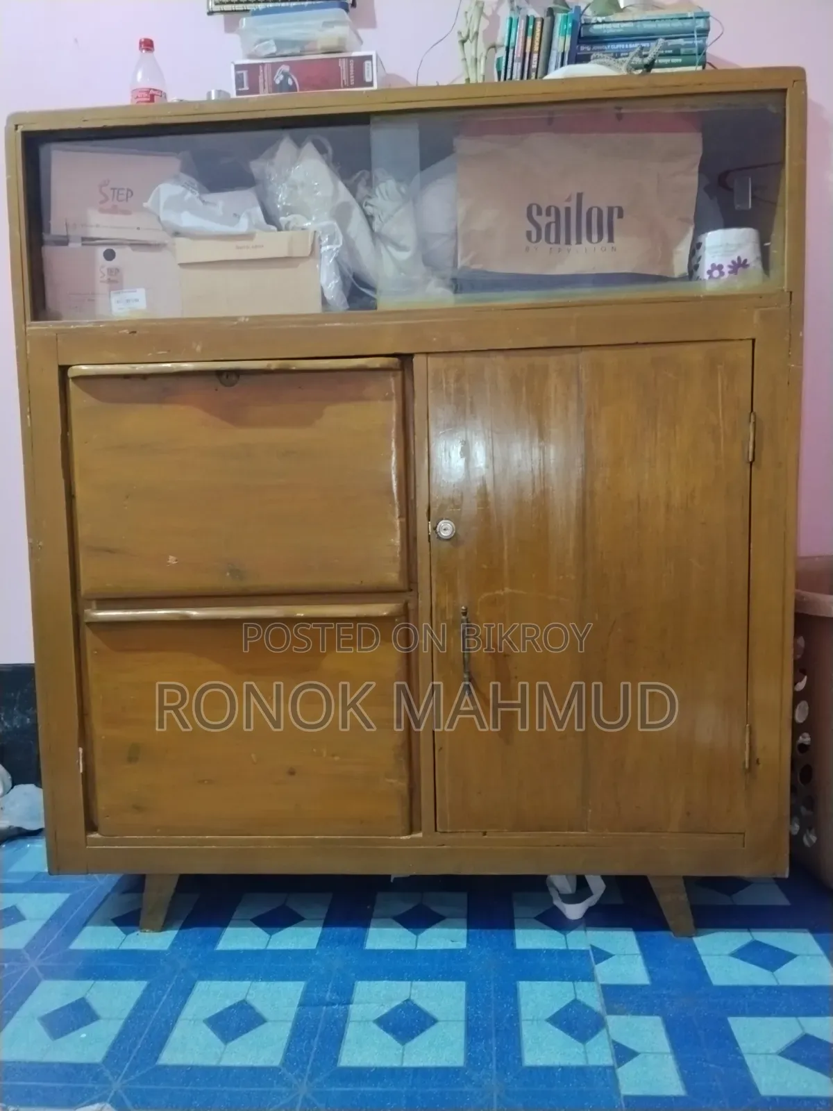 A wooden wardrobe for sale.
