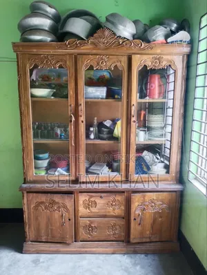 A teak wood showcase will be sold