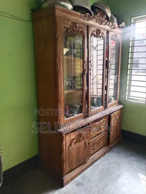 A teak wood showcase will be sold