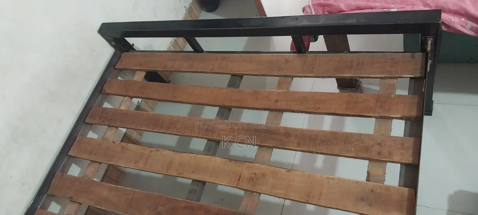 Semi-double steel bed for sale.