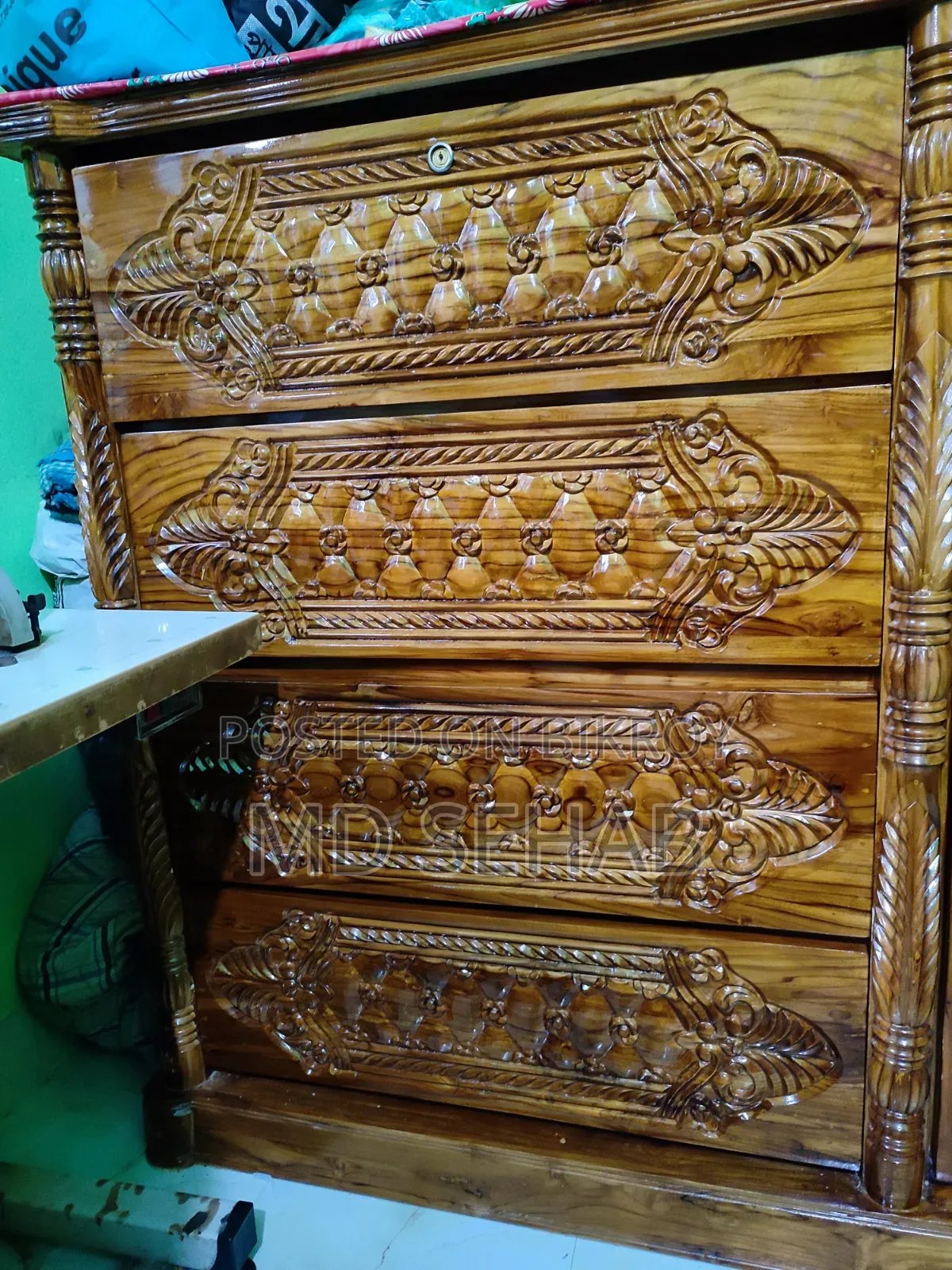 A 4 feet by 5 feet teak wood wardrobe will be sold.