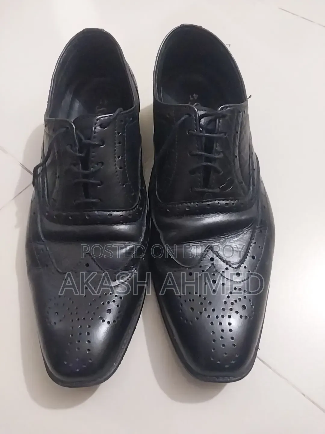 A pair of 100% leather shoes for sale