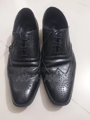 A pair of 100% leather shoes for sale