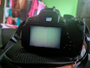 Canon EOS Kiss X7i With 50mm 75-300mm Lens