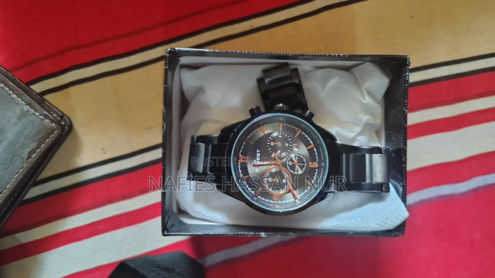 A new Forest Band watch will be sold. The watch is unused.