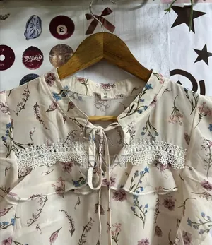 beige ruffled blouse