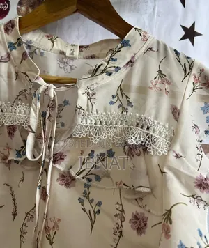 beige ruffled blouse