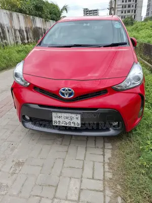 টয়োটা প্রিয়াস ৪ দরজা হ্যাচব্যাক (১.৮ লিটার ৪-সিলিন্ডার গ্যাস/ইলেকট্রিক হাইব্রিড সিভিটি) ২০১৬ লাল