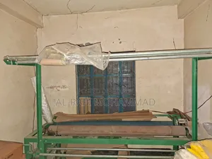 ফেব্রিক্স রোল বাইন্ডিং মেশিন