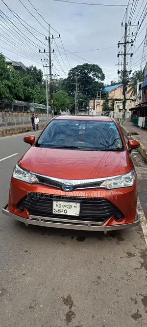 টয়োটা করোল্লা ফিল্ডার ১.৫ হাইব্রিড এফডব্লিউডি ২০১৬ অরেঞ্জ