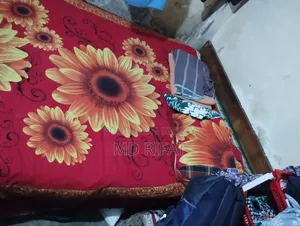 A used teak wood bed