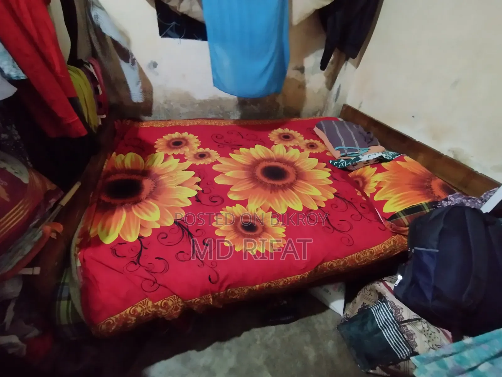 A used teak wood bed