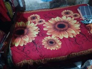 A used teak wood bed