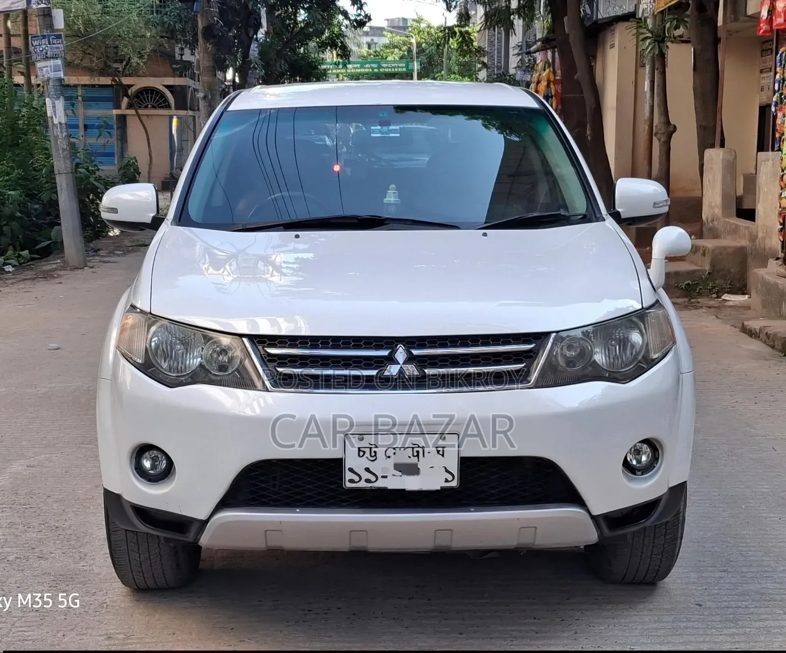মিতসুবিশি আউটল্যান্ডার এক্সএলএস ২০০৯ সাদা