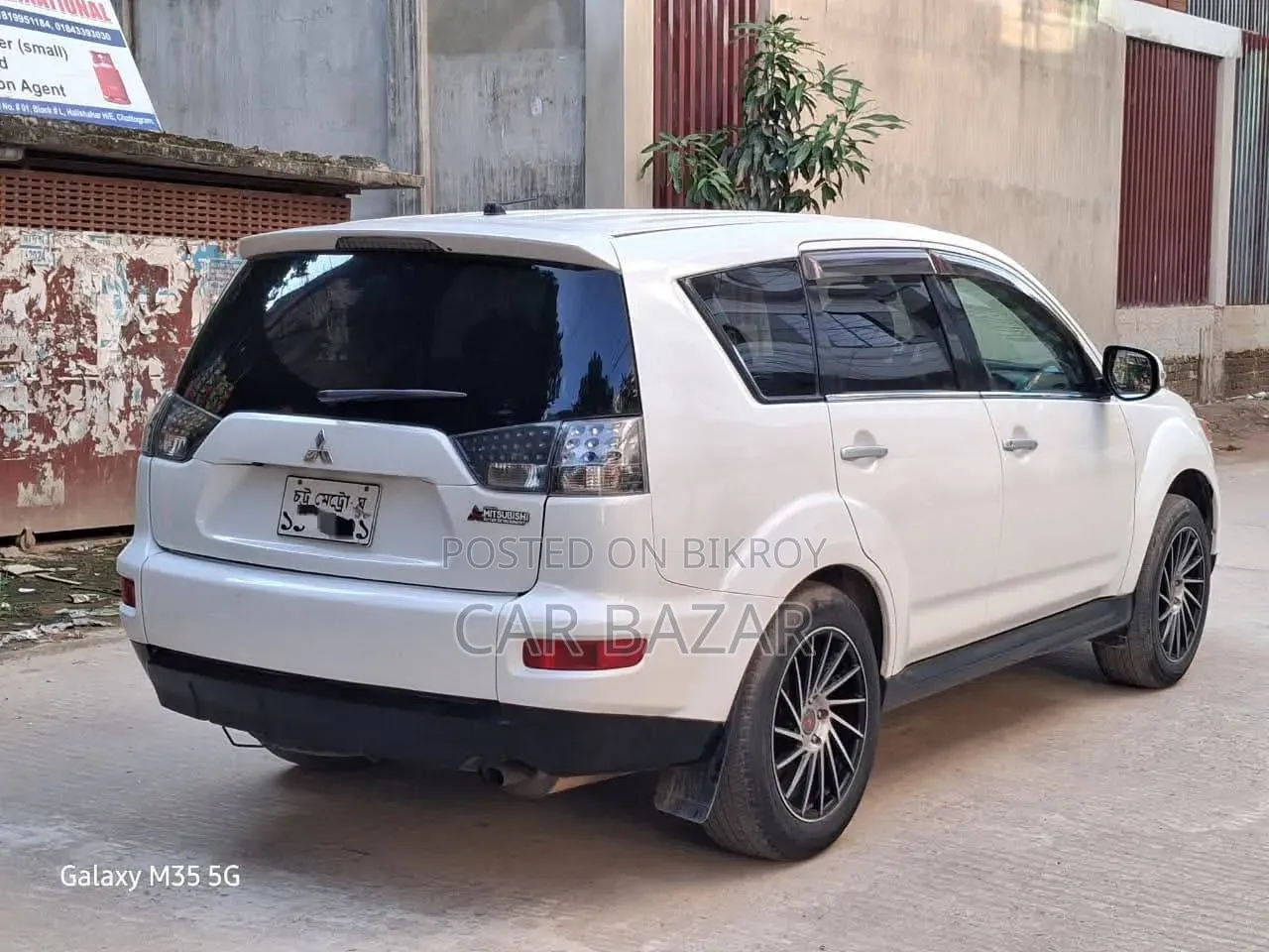 মিতসুবিশি আউটল্যান্ডার এক্সএলএস ২০০৯ সাদা