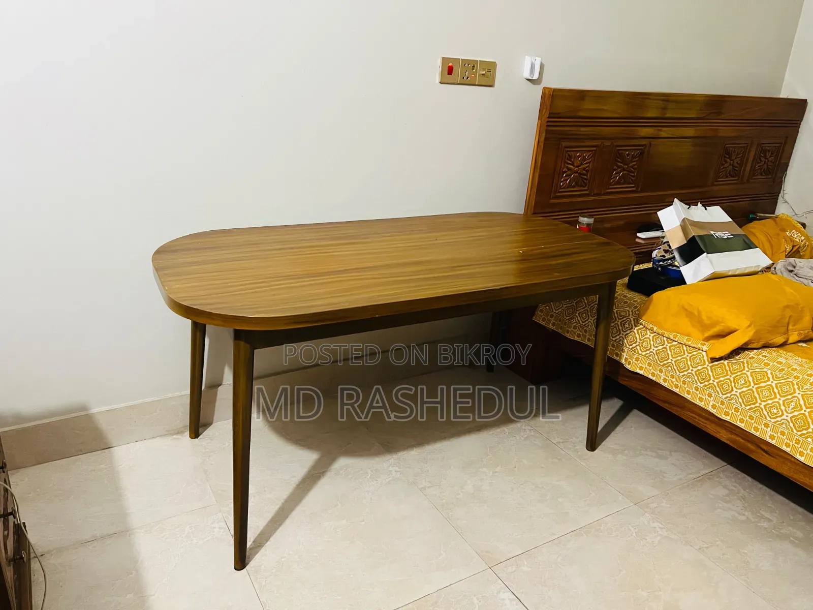 For Sale – A wooden table will be sold.