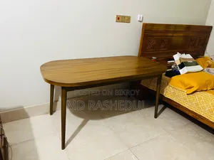 For Sale – A wooden table will be sold.