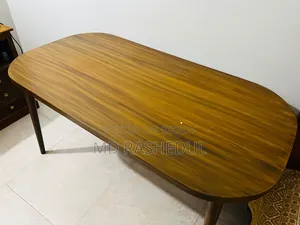 For Sale – A wooden table will be sold.