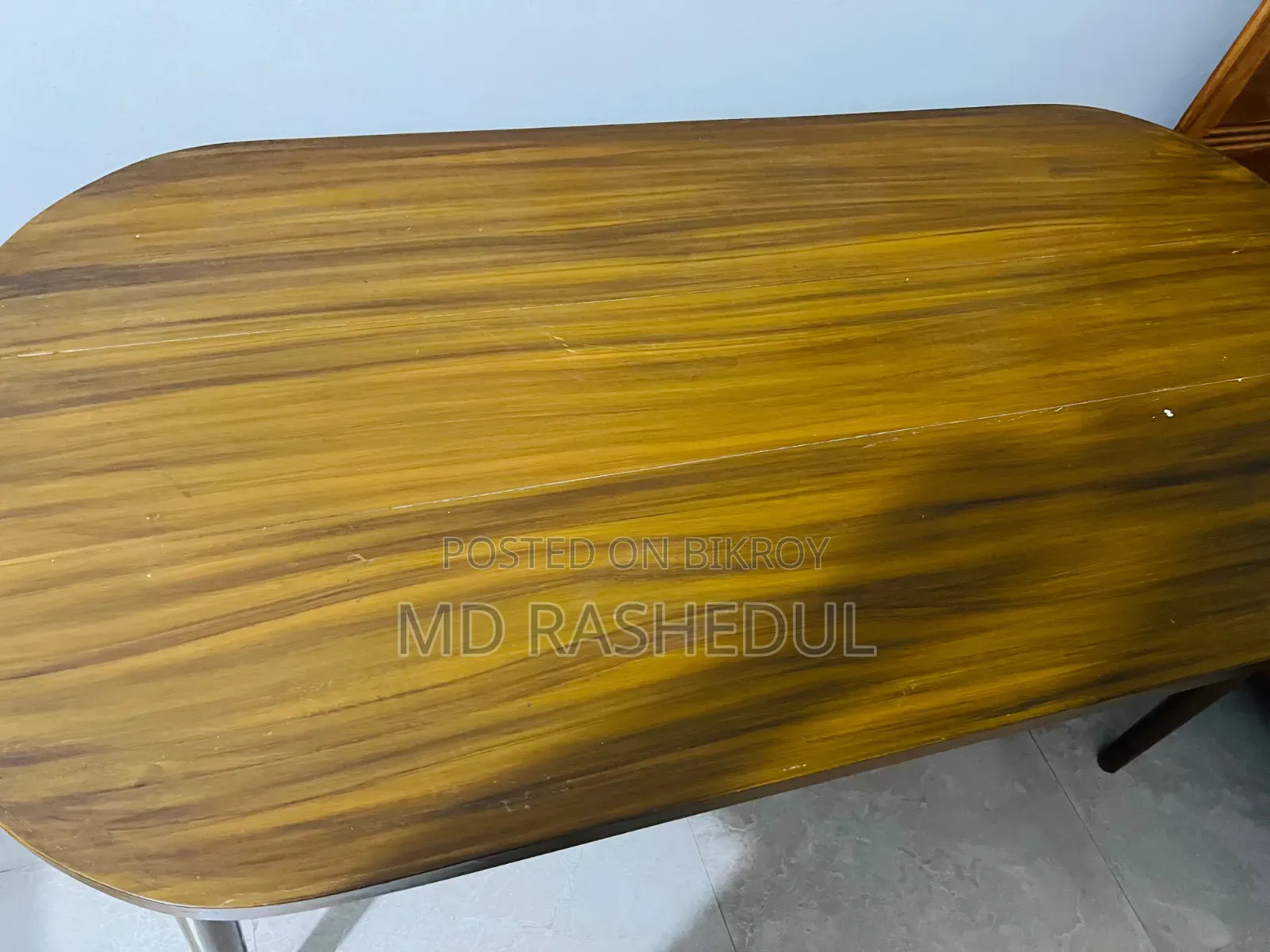 For Sale – A wooden table will be sold.