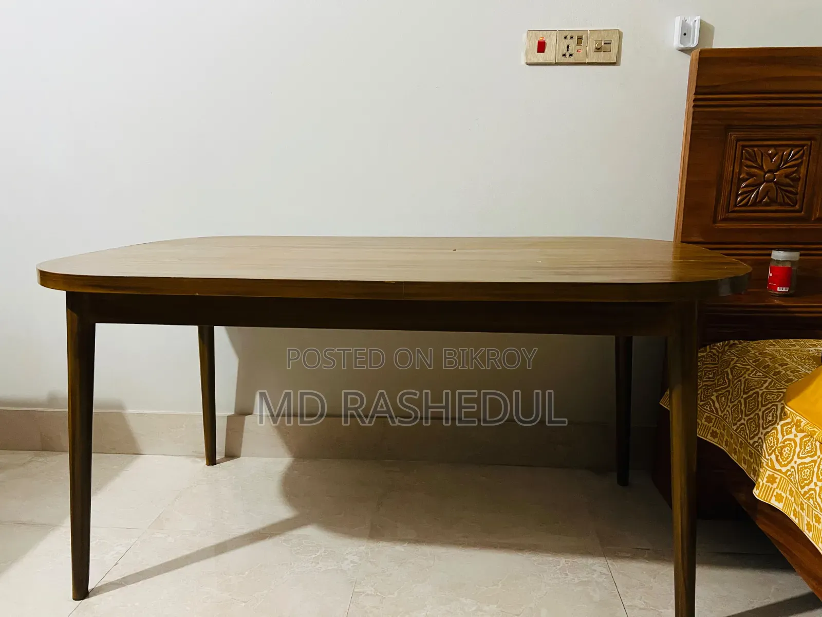 For Sale – A wooden table will be sold.