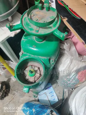 দুধ থেকে ক্রিম বের করার মেশিন