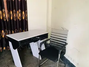 2 used customized computer tables and 2 chairs.
