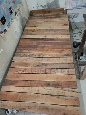 Wooden bed frame and table will be sold.