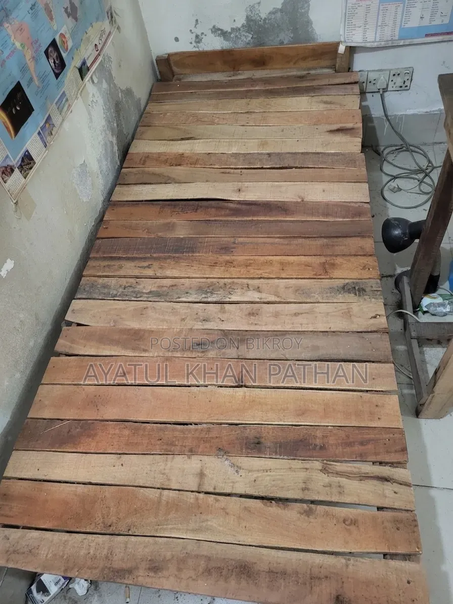 Wooden bed frame and table will be sold.